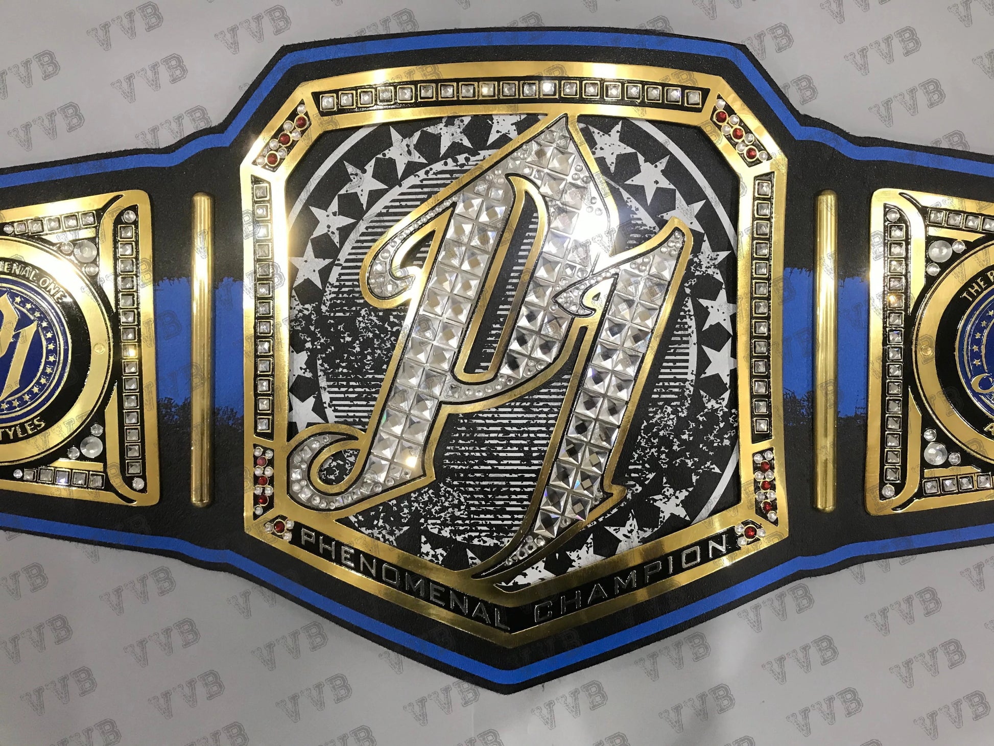 Decorative belt with a prominent emblem on a gray background