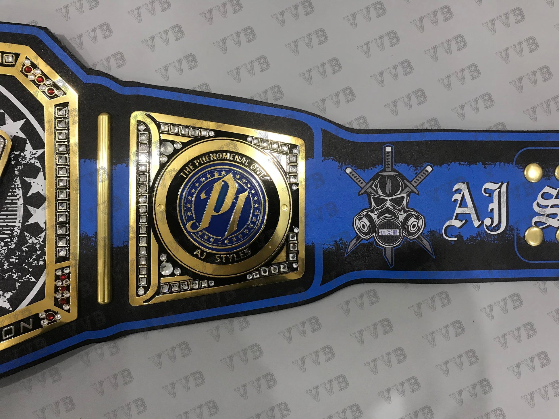 Wrestling championship belt with logos and text on a gray background